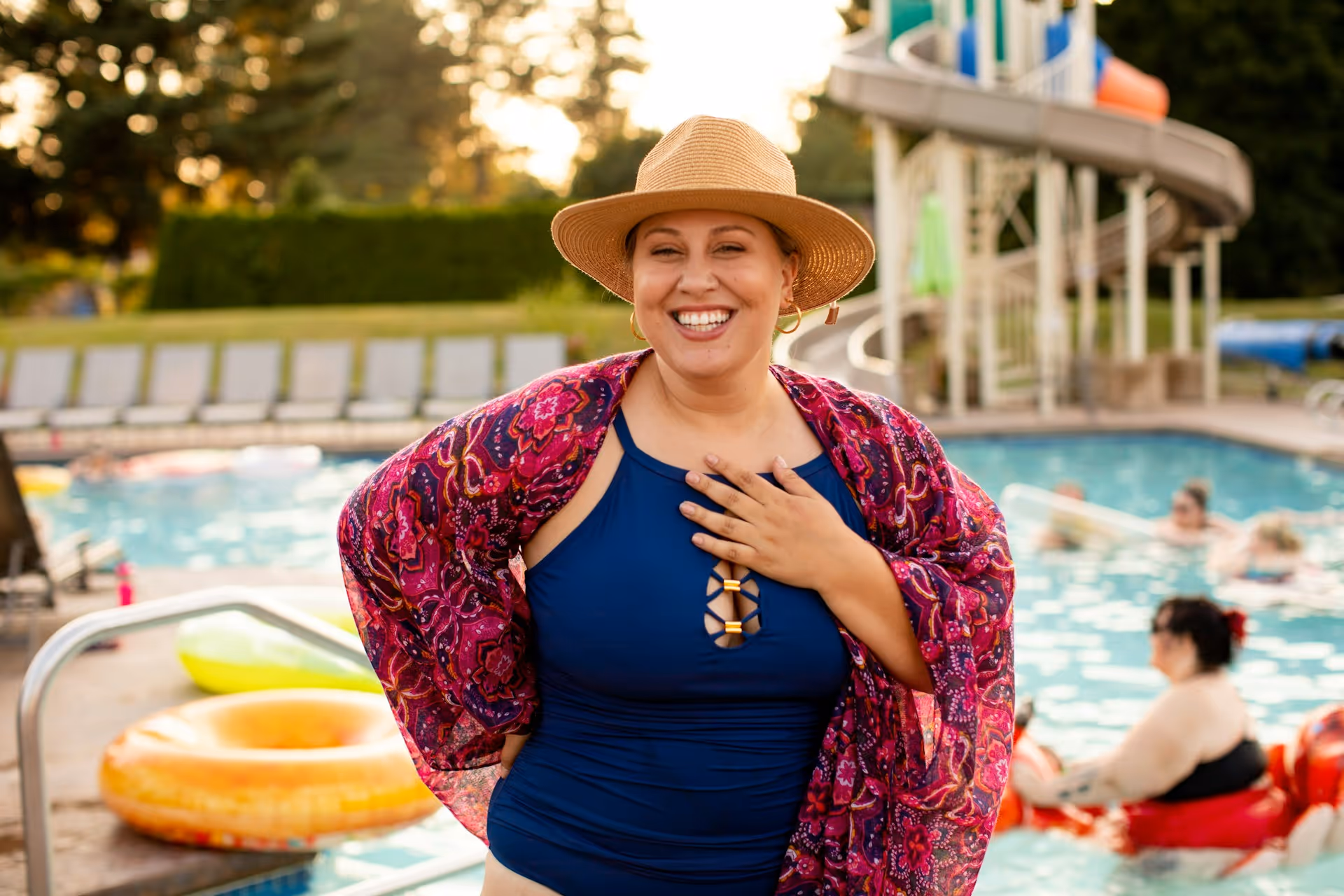 Plus size woman enjoying a summer pool
