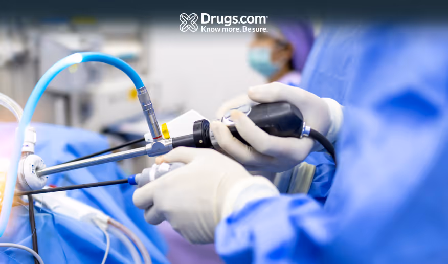 Doctor performing an endoscopic procedure inside an operating room in a hospital