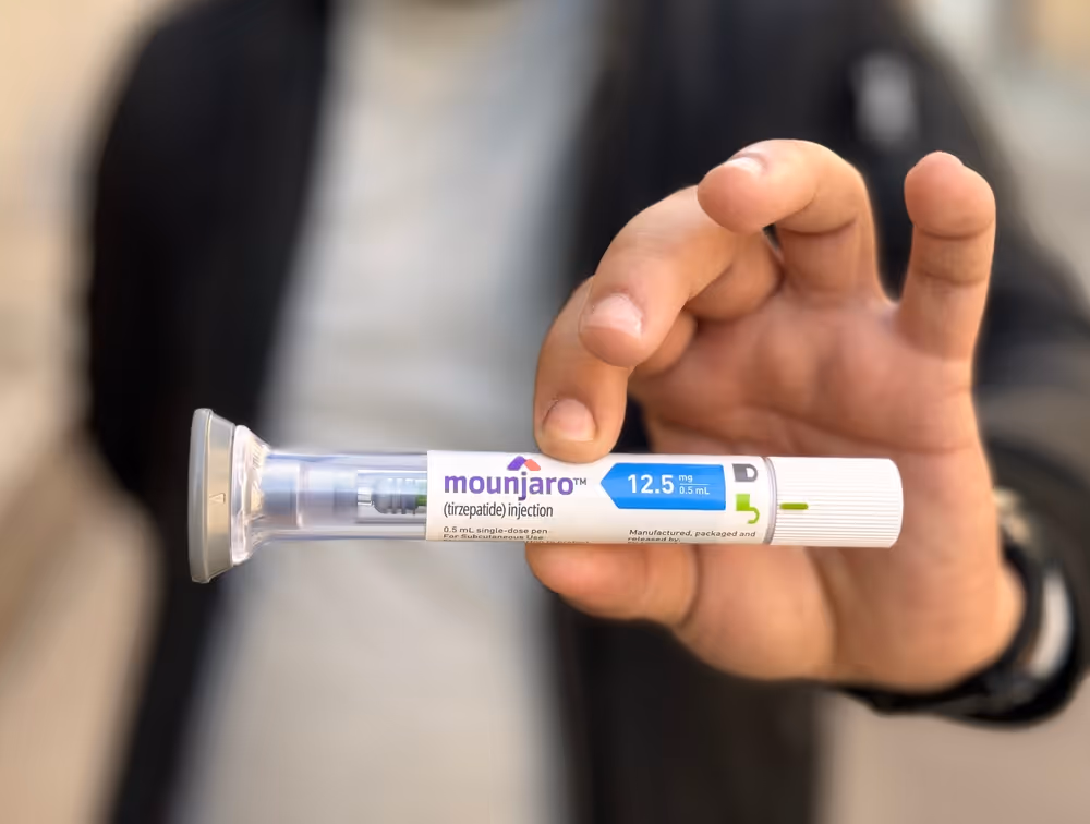 A person holding up Mounjaro