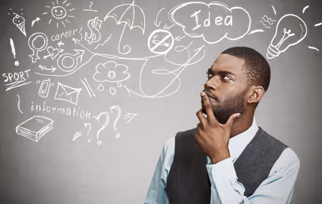 Hombre con chaleco pensando, rodeado de varios garabatos que representan ideas y conceptos.