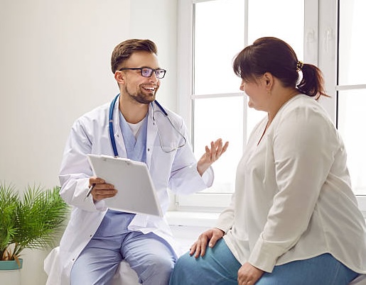 A doctor and patient discussing non-surgical weight loss options like ESG and the gastric balloon which are safe, effective, and no surgery required.